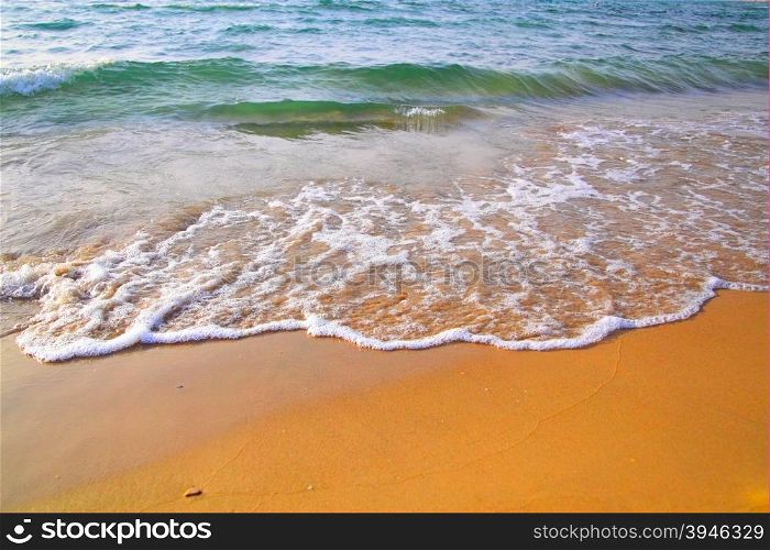 Beach with clear water and waves
