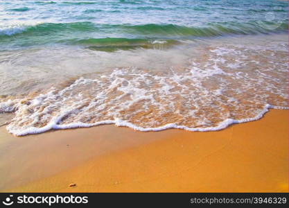 Beach with clear water and waves