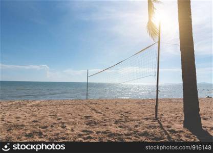 Beach with Volleyball net. Seascape and ocean concept. Summer and Vacation theme. Sunshine element. Vintage matte tone