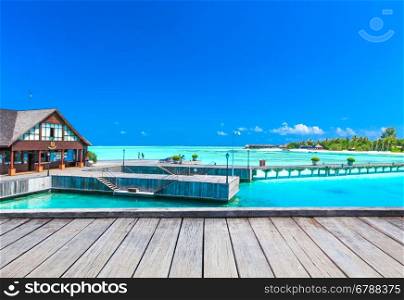 beach with water bungalows at Maldives