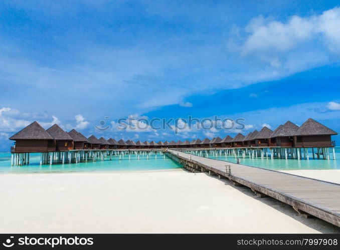 beach with water bungalows at Maldives