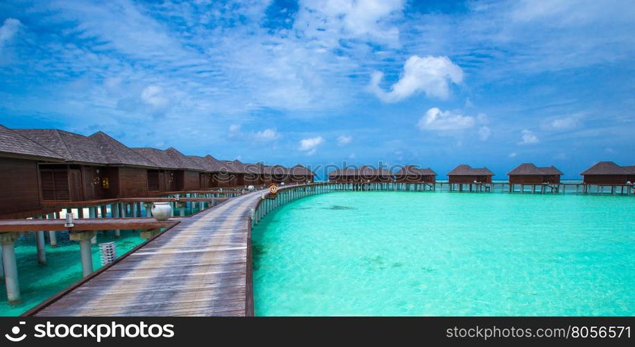 beach with water bungalows at Maldives