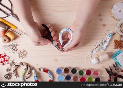 Beads and tools for creating jewelry. Preparation for handmade. Top view. Handmade beading preparation