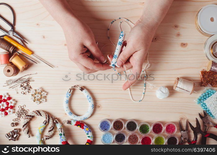 Beads and tools for creating jewelry. Preparation for handmade. Top view. Handmade beading preparation