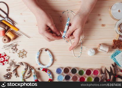 Beads and tools for creating jewelry. Preparation for handmade. Top view. Handmade beading preparation