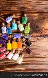 Beads in the vintage mini glass bottles. Colorful beads in the bottles