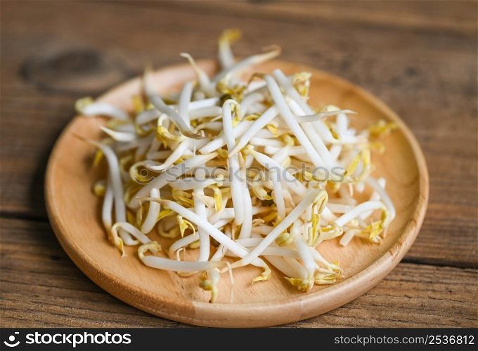 Bean sprouts on wooden plate table background in the kitchen, Raw white organic bean sprouts or mung bean sprout for food vegan
