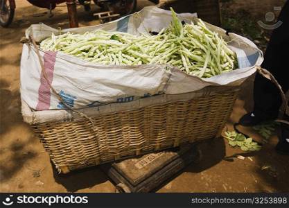 Beans in a basket at a market stall, Zhigou, Shandong Province, China