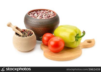 beans in pot and vegetables isolated on white
