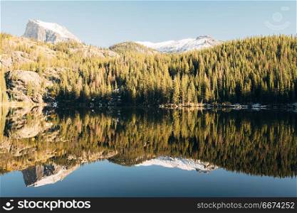 Bear Lake, Rocky Mountains, Colorado, USA. . Bear Lake and reflection with mountains in snow around at autumn. Rocky Mountain National Park in Colorado, USA.