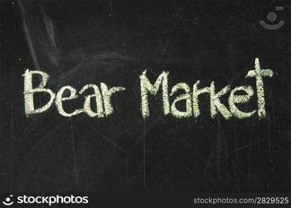 BEAR MARKET words, written with chalk on a blackboard.