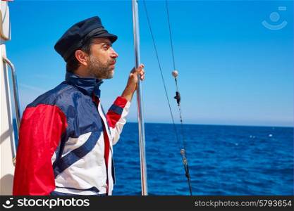 Beard sailor man sailing sea ocean in a boat with captain cap