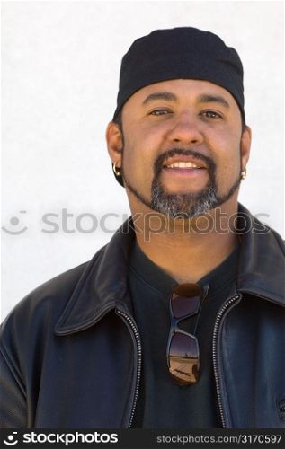 Bearded Man in Cap and Leather Jacket