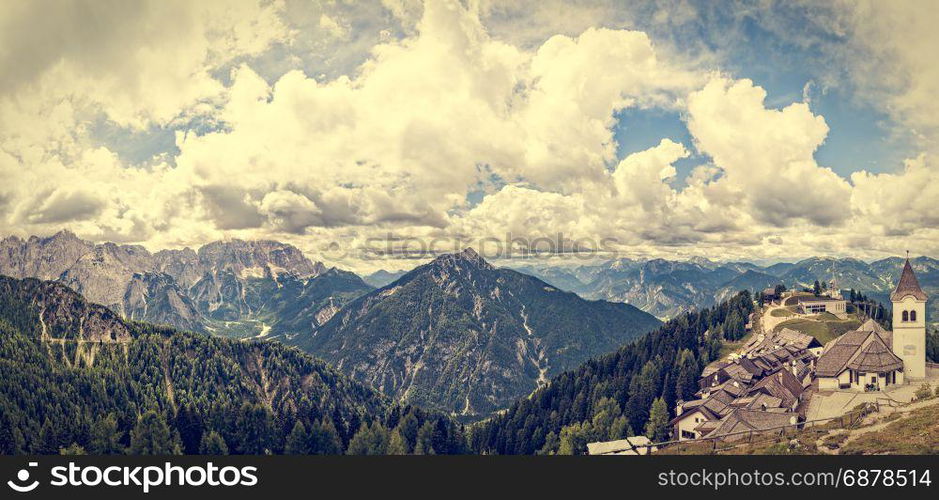 Beatifull mountain landscape with typical village ,church and belfry. Monte Lussari Italy