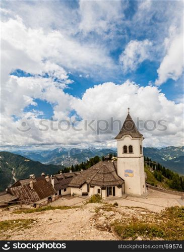 Beatifull mountain landscape with typical village ,church and belfry. Monte Lussari Italy
