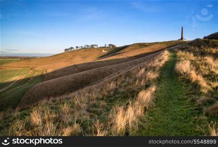 Beauitful landscape of ancient chalk white horse in hill at Cherhill in Wiltshire England during Autumn evening