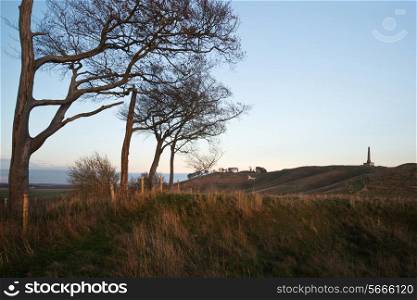 Beauitful landscape of ancient chalk white horse in hill at Cherhill in Wiltshire England during Autumn evening
