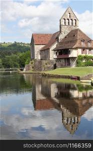 Beaulieu sur Dordogne and the chapel of Penitents along the Dordogne river, France