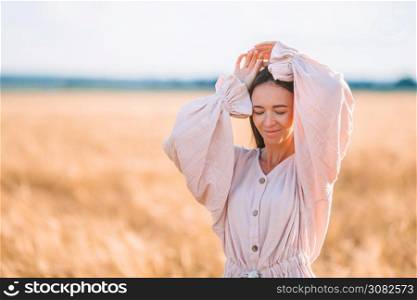 Beautful woman in wheat field close up. Portrait of beautiful woman in summer day