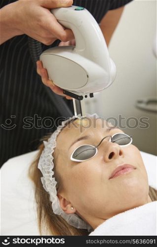 Beautician Carrying Out Intense Pulse Light Treatment