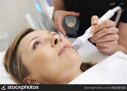 Beautician Carrying Out Ultrasound Skin Rejuvenation Treatment