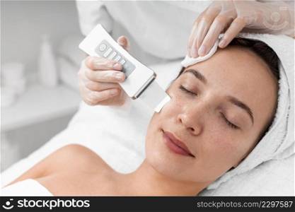beautician doing face beauty routine female client
