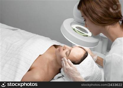 beautician doing face beauty routine female client 3