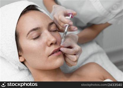 beautician doing injection filler female client 6