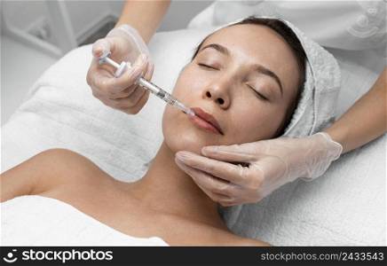 beautician doing injection filler female client 8