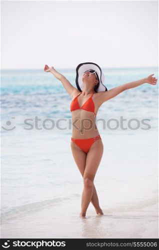 beautifel and happy woman girl on beach have fun and relax on summer vacation over the sea