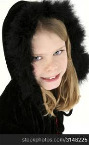 Beautiful 10 year old girl in black feather winter hooded sweater.