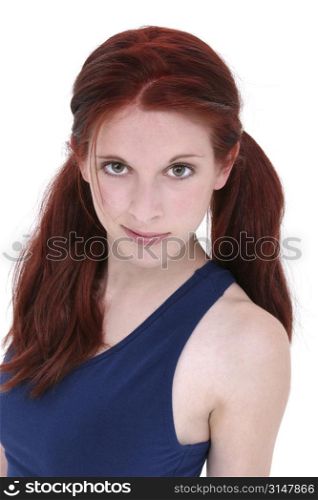Beautiful 17 year old girl with long red hair over white.