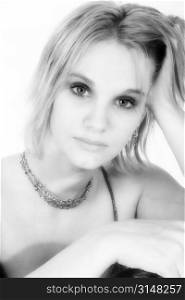 Beautiful 17 year old young woman in black and white. Headshot over white.