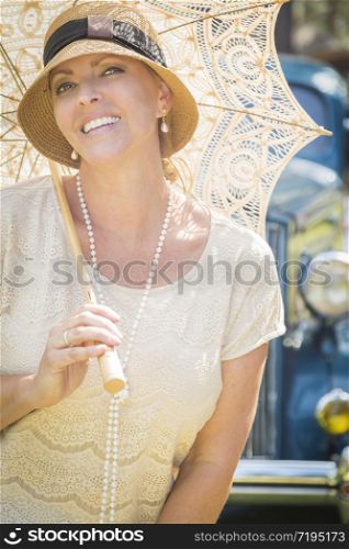 Beautiful 1920s Dressed Girl with Parasol Near Vintage Car Portrait.