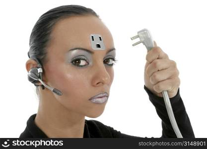 Beautiful 23 year old Bulgarian woman with three prong plug in hand. Outlet on forehead. Wearing communication earpiece.