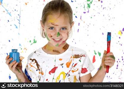 Beautiful 6 year old girl covered in paint.