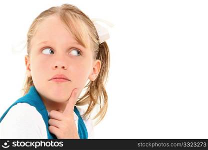 Beautiful 7 year old american girl with wondering expression over white background.