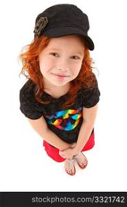 Beautiful 7 year old girl with curly red hair standing over white background looking up. Top view.