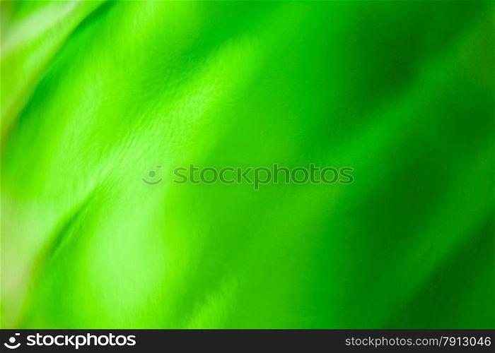 Beautiful abstract background of green wavy glass