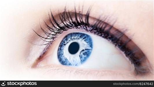 Beautiful abstract blue eye, extreme closeup