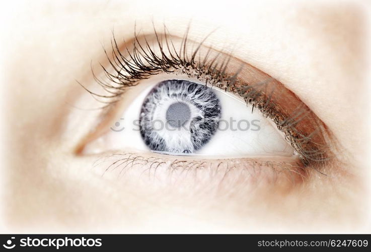 Beautiful abstract blue eye, female face part, healthy vision, extreme closeup