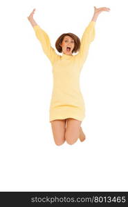 Beautiful adult woman jumping with hands up against of white background. Isolated, studio shot.