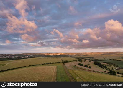 Beautiful aerial drone landscape image of South Downs NP at sunrise in Summer