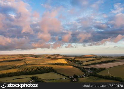 Beautiful aerial drone landscape image of South Downs NP at sunrise in Summer