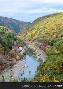Beautiful aerial scenery of Asashiyama mountain and Hozugawa river in autumn season, Kyoto, Japan
