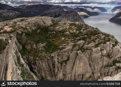 Beautiful aerial view from mountains to fjord in Norway. High quality photo. Beautiful aerial view from mountains to fjord in Norway