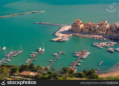 Beautiful aerial view of medieval fortress in Cala Marina, harbor in coastal city Castellammare del Golfo in the morning, Sicily, Italy. Castellammare del Golfo, Sicily, Italy