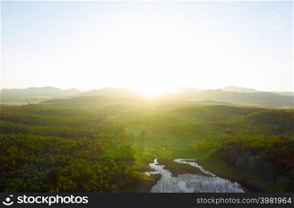 Beautiful Aerial view sunrise over the mountain range at the north of thailand, Beauty rainforest landscape with fog in morning- Drone.. Aerial view north of thailand.