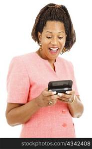 Beautiful african-american businesswoman laughing as she reads a text message on her smart phone. Isolated on white.