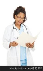 Beautiful african-american doctor reading a patient&rsquo;s medical chart. Isolated on white.